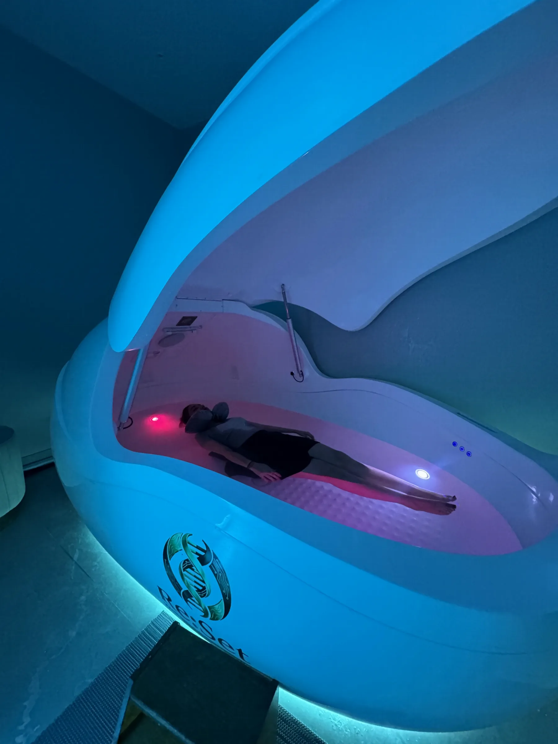 A guest floating in the Reset Wellness floatation pod in Gurgaon